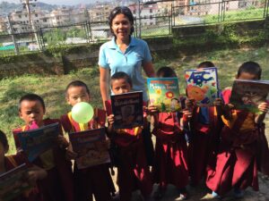 Photo of Ven. Silananda (Christina Manriquez) teaching English to young monks in Nepal, 2016.